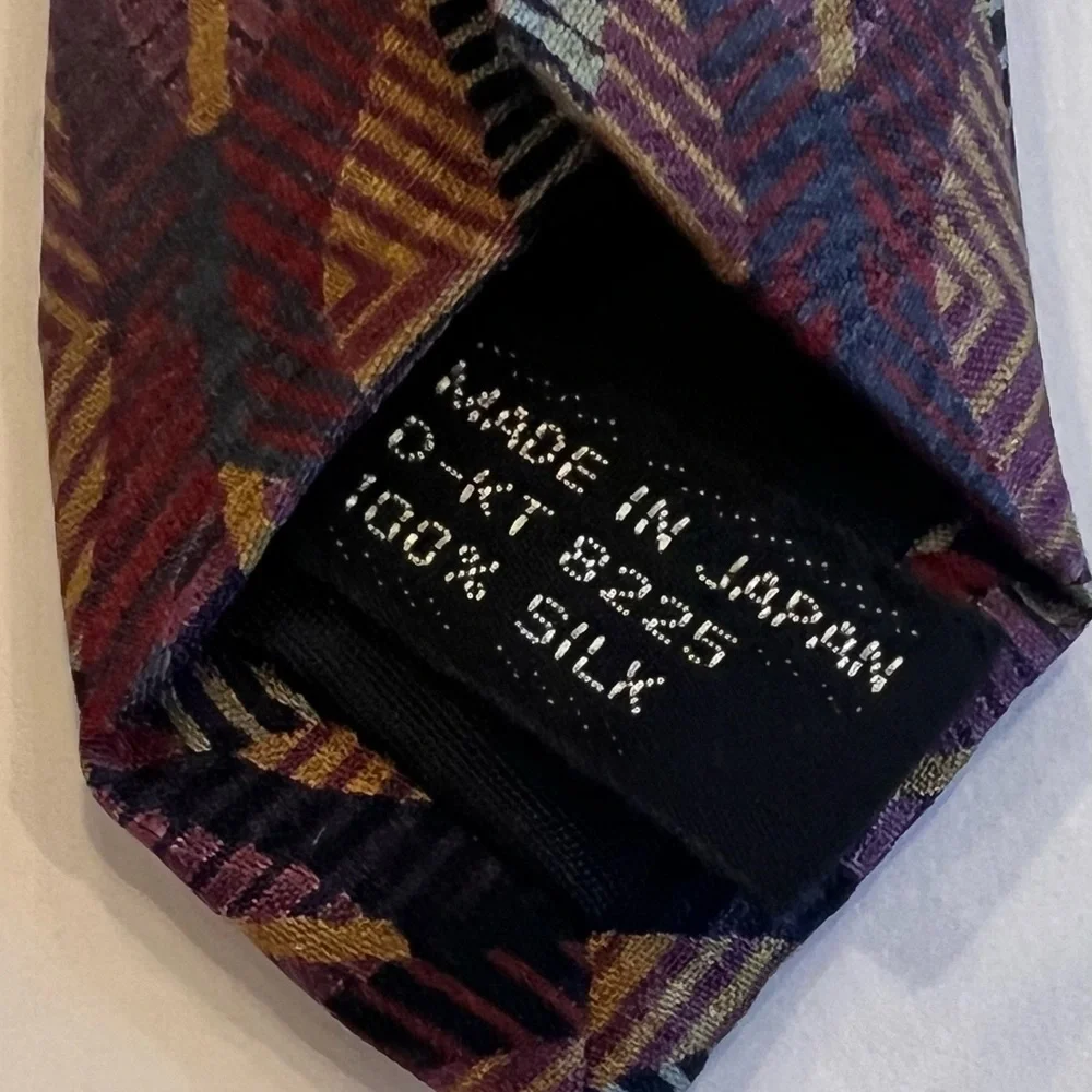 Vintage tie with price tag that has a history Jhane Barnes Abstract design
